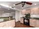 Updated kitchen features granite countertops, custom cabinetry, stainless steel appliances, and an oven at 4612 W Waltann W Ln, Glendale, AZ 85306