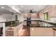 This spacious kitchen features granite countertops, custom cabinetry and stainless steel appliances at 4612 W Waltann W Ln, Glendale, AZ 85306