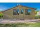 Charming outbuilding featuring a brick patio, an exterior door, and windows at 4612 W Waltann W Ln, Glendale, AZ 85306
