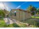 A charming outbuilding fenced for privacy with a mature tree at 4612 W Waltann W Ln, Glendale, AZ 85306
