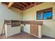 The home's outdoor kitchen features ample counter space, a grill, and wood cabinets at 4612 W Waltann W Ln, Glendale, AZ 85306