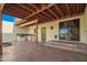 Enjoy outdoor living with this covered patio featuring a built-in grill and bar area at 4612 W Waltann W Ln, Glendale, AZ 85306