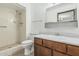 This bathroom features a tiled shower and a vanity at 4728 N 61St Ave, Phoenix, AZ 85033