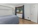 This bedroom features wood-look floors, a closet, and a window at 4728 N 61St Ave, Phoenix, AZ 85033