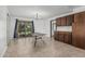 Bright dining area with tiled floor and sliding glass door leading to the outdoor space at 4728 N 61St Ave, Phoenix, AZ 85033