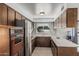 Functional kitchen featuring tile floors, stainless steel appliances, and ample counter space at 4728 N 61St Ave, Phoenix, AZ 85033