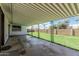 Expansive covered patio with view of the backyard, great for entertaining or relaxing outdoors at 4728 N 61St Ave, Phoenix, AZ 85033