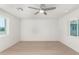 Bright bedroom featuring ample natural light from the windows and light hardwood floors at 4901 W Augusta Cir, Glendale, AZ 85308