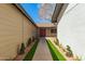 Inviting walkway to the front door with charming landscaping and manicured lawn at 4901 W Augusta Cir, Glendale, AZ 85308