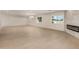 Open living space featuring neutral walls, recessed lights, fireplace, and ample natural light from large windows at 4901 W Augusta Cir, Glendale, AZ 85308