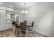 Dining room featuring a round table and chairs and a view to the modern kitchen at 5015 E Cheyenne Dr # 10, Phoenix, AZ 85044