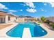 Inviting backyard featuring a swimming pool, diving board, and lush landscaping at 5115 W Kings Ave, Glendale, AZ 85306