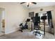 Bedroom featuring a home office and exercise bike at 5115 W Kings Ave, Glendale, AZ 85306