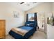 Bedroom featuring vaulted ceilings, neutral walls, plush carpeting, and a comfortable bed at 5115 W Kings Ave, Glendale, AZ 85306