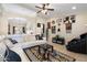 Spacious living room showcasing a long white sofa, accent rug, and open archway to the dining area at 5115 W Kings Ave, Glendale, AZ 85306