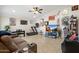 Open-concept living room with tile floors, ceiling fan and a variety of artwork at 5115 W Kings Ave, Glendale, AZ 85306