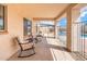 Inviting covered patio with neutral chairs, offering a comfortable outdoor living space at 5115 W Kings Ave, Glendale, AZ 85306