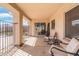 Relaxing covered patio with patio seating, ideal for enjoying the outdoors with a view of the backyard at 5115 W Kings Ave, Glendale, AZ 85306