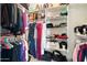 Organized walk-in closet with shelving, hanging rods and plenty of room for storage at 5115 W Kings Ave, Glendale, AZ 85306