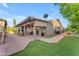 Spacious backyard with covered patio, artificial turf, and ample space for outdoor enjoyment at 6126 W Sweetwater Ave, Glendale, AZ 85304