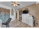 Cozy bedroom features a ceiling fan, light wood floors, and neutral paint at 6126 W Sweetwater Ave, Glendale, AZ 85304
