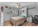 Stylish bedroom featuring a Murphy bed and built-in shelving at 6126 W Sweetwater Ave, Glendale, AZ 85304