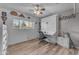 Spare bedroom featuring a Murphy bed, sleek flooring, and lots of natural light at 6126 W Sweetwater Ave, Glendale, AZ 85304