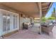 Inviting covered patio features comfortable seating and stylish decor, perfect for outdoor relaxation and entertaining at 6126 W Sweetwater Ave, Glendale, AZ 85304