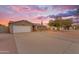 Charming single-story home featuring a two-car garage, mature landscaping, and a welcoming facade at 6126 W Sweetwater Ave, Glendale, AZ 85304
