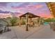 Backyard gazebo has an outdoor dining table at 6126 W Sweetwater Ave, Glendale, AZ 85304