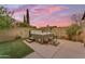 Relax in this backyard hot tub surrounded by privacy walls and beautiful sunset views at 6126 W Sweetwater Ave, Glendale, AZ 85304