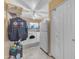 Large laundry room with washer, dryer, and access to extra storage at 6126 W Sweetwater Ave, Glendale, AZ 85304