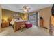 Comfortable main bedroom featuring a ceiling fan and sliding glass door access to the yard at 6126 W Sweetwater Ave, Glendale, AZ 85304