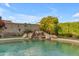 Backyard pool with a custom waterfall feature at 6126 W Sweetwater Ave, Glendale, AZ 85304