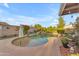 An alternate view of the backyard pool with small beach area at 6126 W Sweetwater Ave, Glendale, AZ 85304
