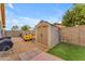 Backyard shed with extra storage, landscaping, and space for a yard and recreational equipment at 6126 W Sweetwater Ave, Glendale, AZ 85304