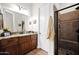 Well-maintained bathroom featuring a walk-in shower with pebble floor, granite vanity and ample storage space at 722 W Claremont St, Phoenix, AZ 85013