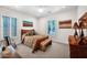 Cozy bedroom with carpet, natural lighting, warm tones and ample closet space, creating a serene retreat at 722 W Claremont St, Phoenix, AZ 85013