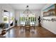 Bright dining area with modern chandelier, floor to ceiling windows with beautiful views, and tile flooring at 722 W Claremont St, Phoenix, AZ 85013