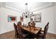 Elegant dining room featuring a decorative light fixture and wall art at 722 W Claremont St, Phoenix, AZ 85013