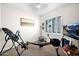 Exercise room with treadmill, natural lighting, and neutral paint, providing a private workout space at 722 W Claremont St, Phoenix, AZ 85013