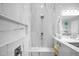 Modern shower with marble tiling, a built-in seat, rainfall showerhead, and sleek fixtures, offering a spa-like experience at 722 W Claremont St, Phoenix, AZ 85013