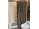 Bathroom with a shower and tub combination and a dark curtain at 7318 E Woodsage Ln, Scottsdale, AZ 85258