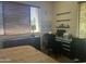 Bedroom and workspace featuring bright light from large window at 7318 E Woodsage Ln, Scottsdale, AZ 85258