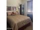 Comfortable bedroom featuring a queen bed, modern decor, and ample natural light at 7318 E Woodsage Ln, Scottsdale, AZ 85258