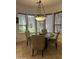 Cozy breakfast nook features a round table, tan chairs, and bright light from a bay window at 7318 E Woodsage Ln, Scottsdale, AZ 85258