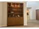Stylish built-in shelving unit with illuminated display space, offering ample storage and decor opportunities at 7318 E Woodsage Ln, Scottsdale, AZ 85258