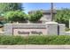 Gainey Village entrance sign with lush landscaping shows community pride and upscale neighborhood appeal at 7318 E Woodsage Ln, Scottsdale, AZ 85258