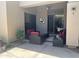 Relaxing covered patio with comfortable seating, ceiling fan, and ample space for outdoor enjoyment at 7318 E Woodsage Ln, Scottsdale, AZ 85258