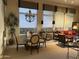 Inviting dining and living area filled with natural light, elegant furnishings, and cozy ambiance at 7318 E Woodsage Ln, Scottsdale, AZ 85258